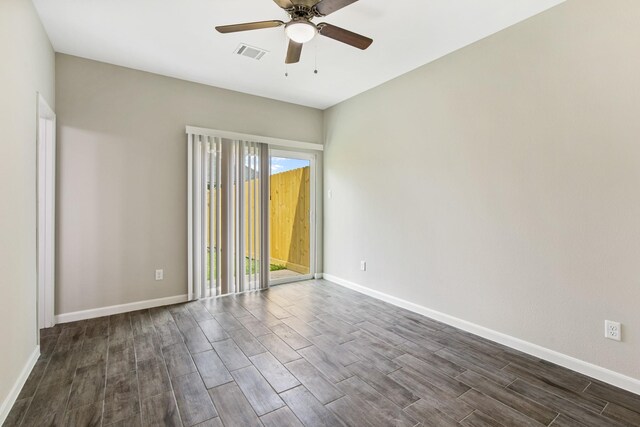 4649 Carmen St, Houston, TX 77051 - empty room with dark wood-style flooring, ceiling fan, and baseboards