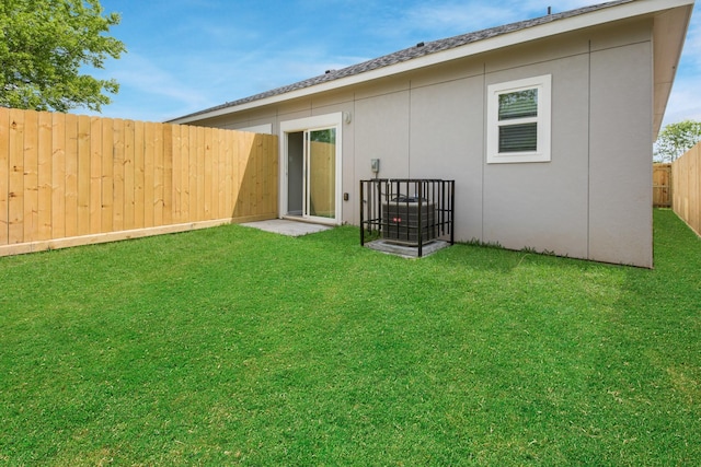 rear view of house with a yard