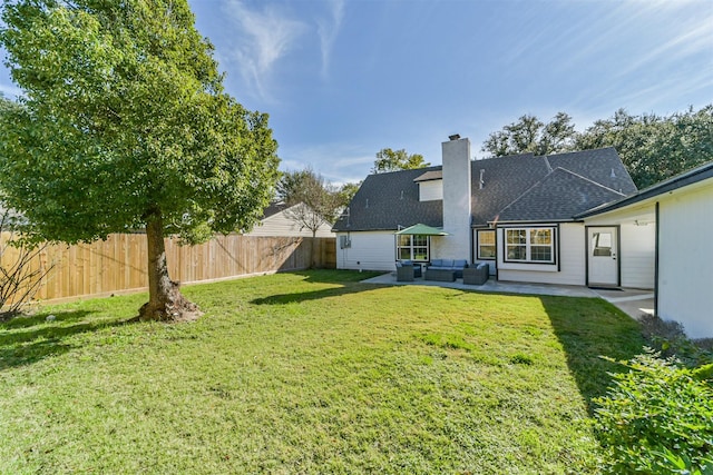 view of yard with outdoor lounge area and a patio area