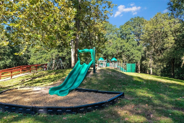 view of playground with a lawn