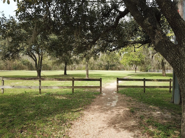 view of gate featuring a yard