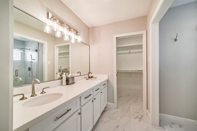 bathroom with vanity and a shower with shower door