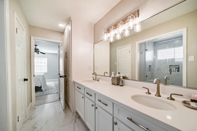 bathroom featuring a wealth of natural light, vanity, an enclosed shower, and ceiling fan