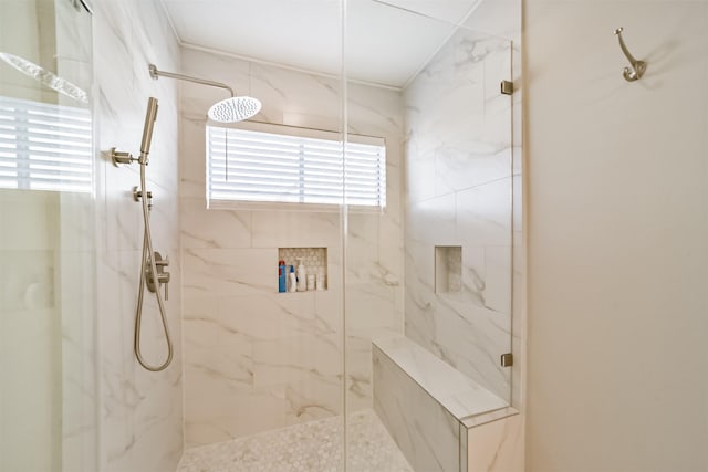 bathroom with tiled shower