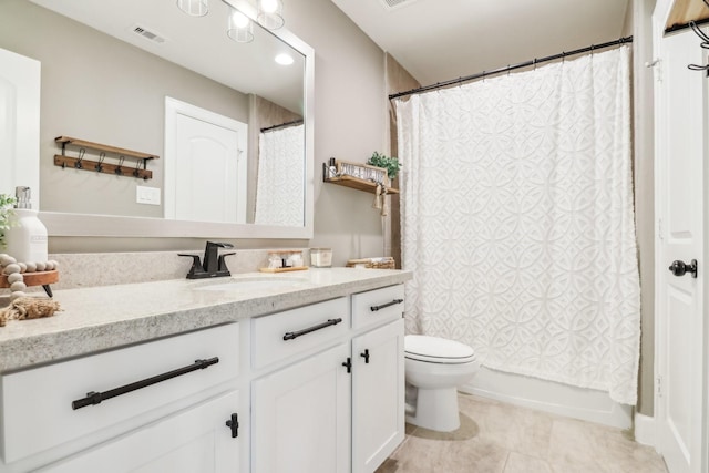 full bathroom with tile patterned flooring, vanity, toilet, and shower / tub combo