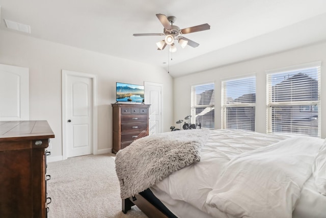 carpeted bedroom featuring ceiling fan and lofted ceiling