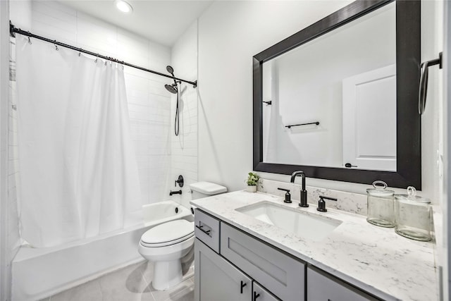 full bathroom featuring shower / tub combo, vanity, tile patterned floors, and toilet