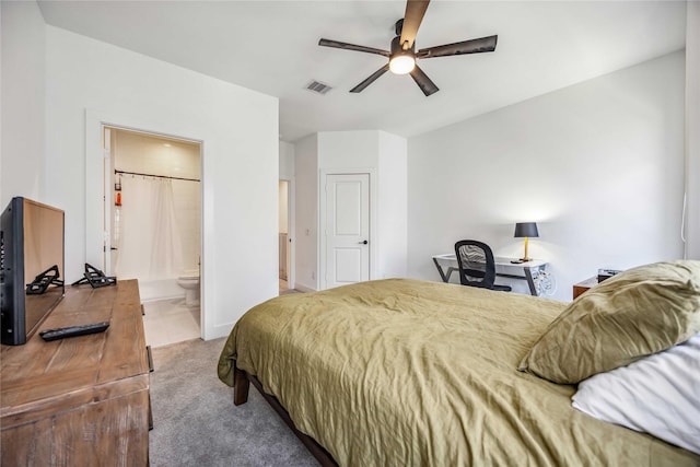 carpeted bedroom with connected bathroom and ceiling fan