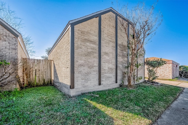 view of home's exterior featuring a yard