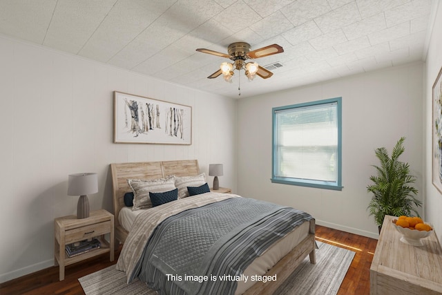 bedroom featuring dark hardwood / wood-style flooring and ceiling fan