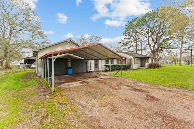 view of home's exterior featuring a carport and a yard