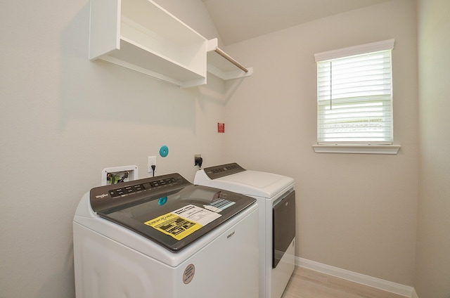 laundry room featuring washing machine and clothes dryer