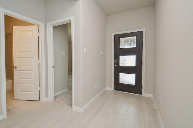 foyer with light wood-type flooring