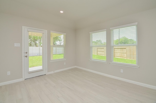 empty room with light hardwood / wood-style floors