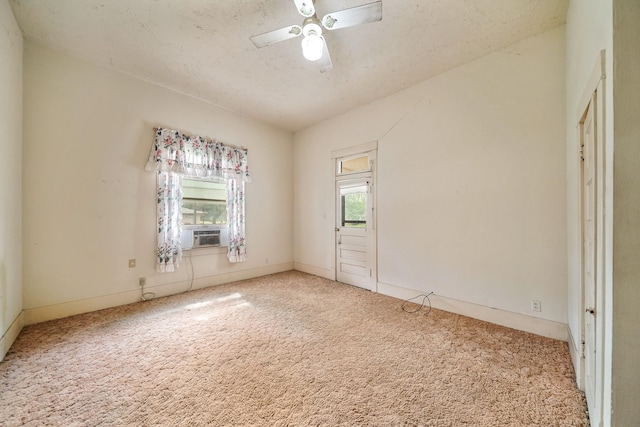 unfurnished room featuring carpet, a textured ceiling, and ceiling fan