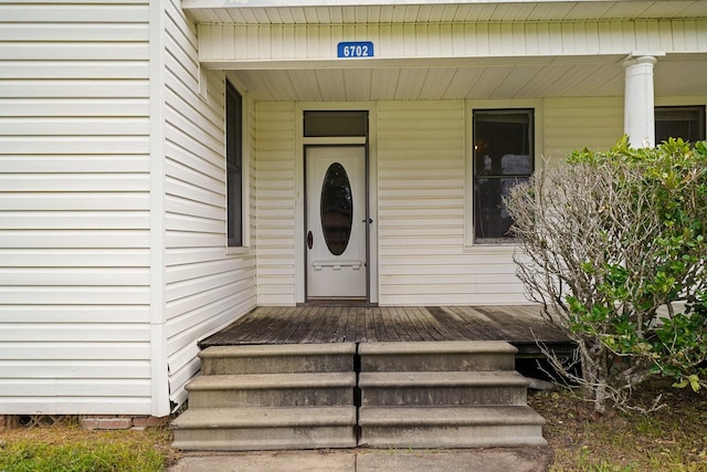 doorway to property featuring covered porch