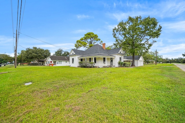 view of front facade with covered porch and a front yard