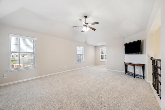 unfurnished living room featuring light colored carpet, ceiling fan, and lofted ceiling