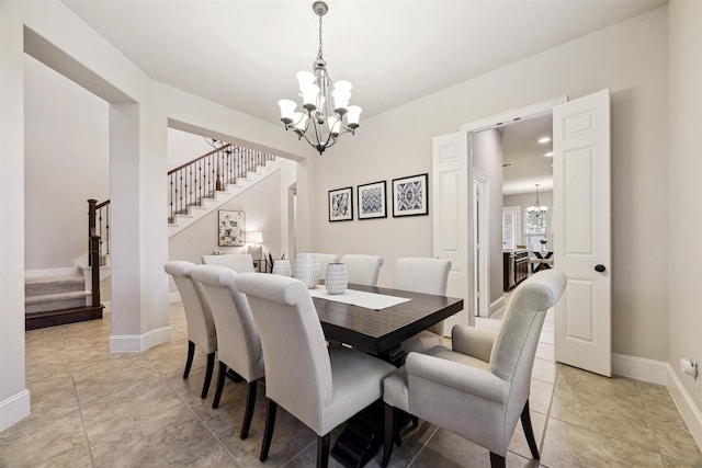 dining space featuring a chandelier