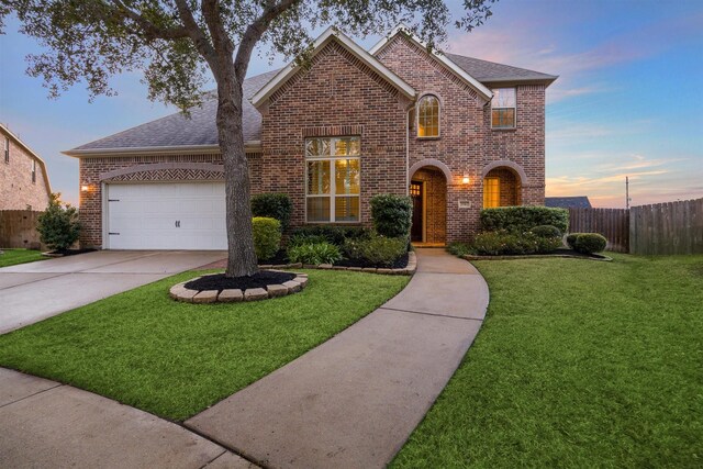 view of front facade featuring a yard and a garage