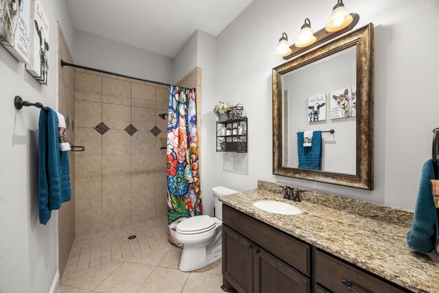 bathroom featuring vanity, tile patterned floors, toilet, and a shower with shower curtain