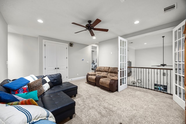 living room with carpet floors, french doors, and ceiling fan