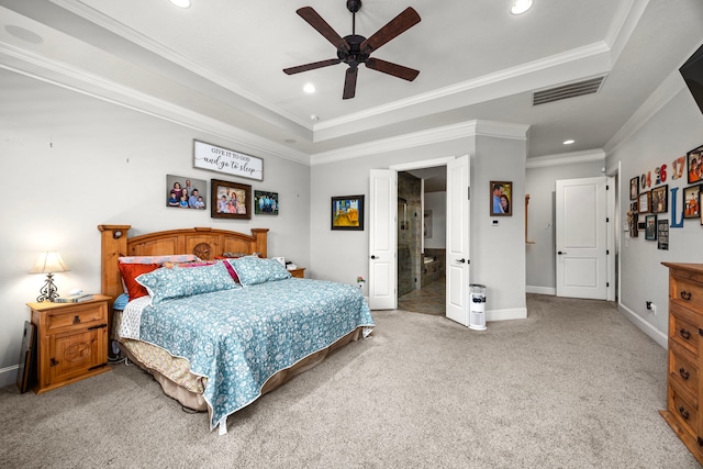 bedroom with crown molding, a tray ceiling, ceiling fan, and carpet