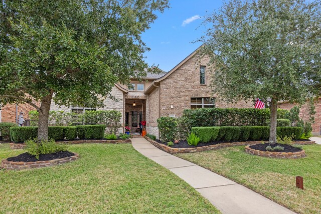 view of front of home with a front yard