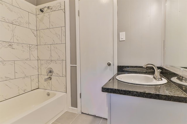 bathroom with vanity, tile patterned floors, and tiled shower / bath