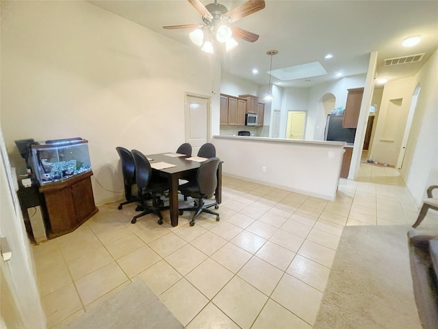 dining room with ceiling fan and light tile patterned floors