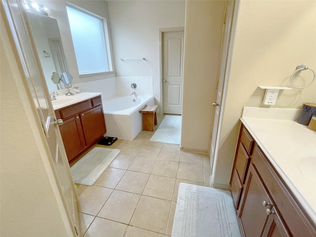 3238 Doves Nest Ct, Dickinson, TX 77539 - full bath with two vanities, tile patterned flooring, and a garden tub