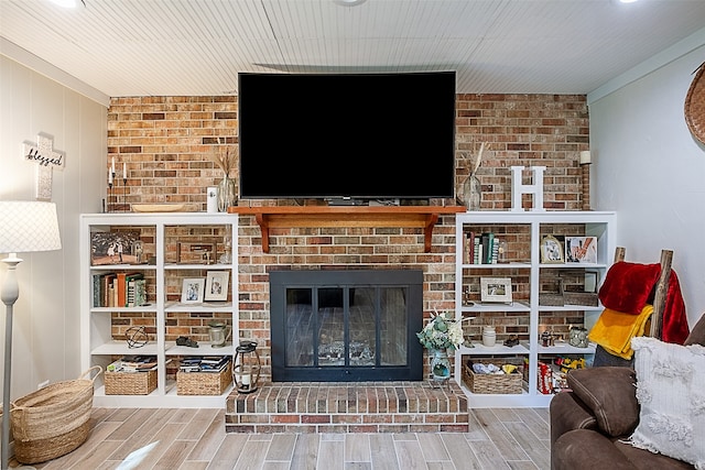 living room with a brick fireplace