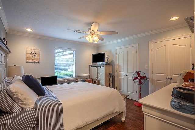 bedroom featuring dark hardwood / wood-style flooring, ceiling fan, and crown molding