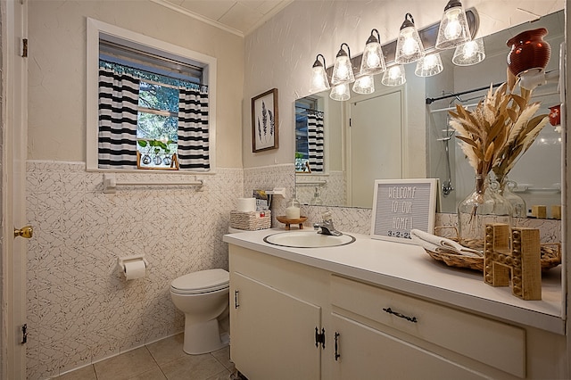 bathroom featuring tile patterned flooring, vanity, tile walls, and toilet