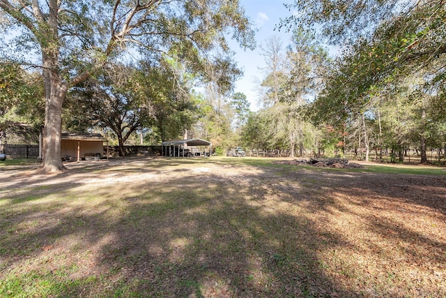 view of yard with a carport