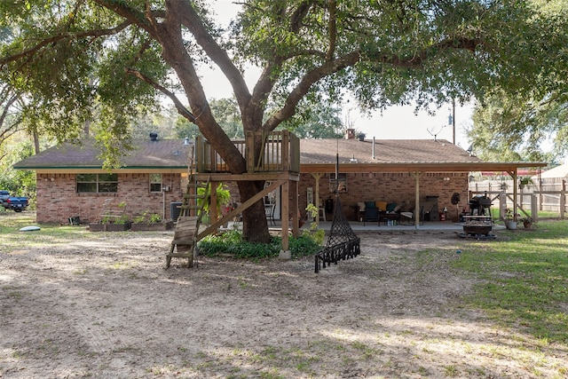 rear view of property with a patio area