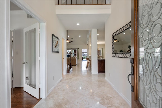 entrance foyer featuring ceiling fan