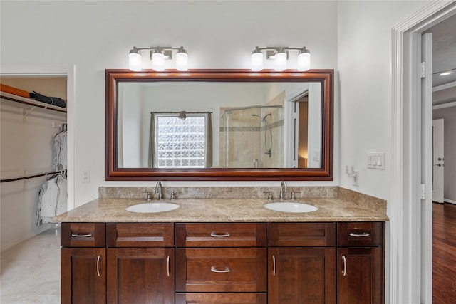 bathroom with vanity and an enclosed shower