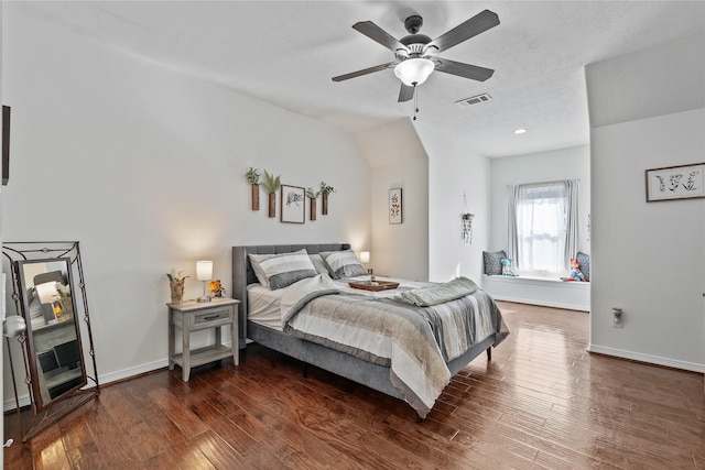 bedroom with dark hardwood / wood-style floors and ceiling fan