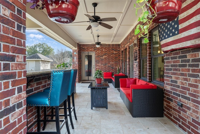 view of patio featuring an outdoor living space, ceiling fan, and an outdoor bar