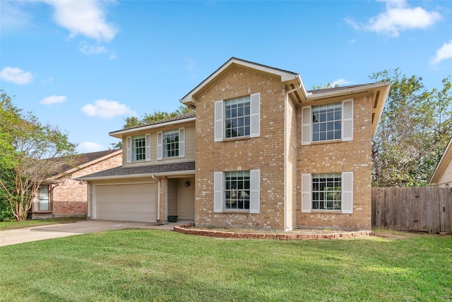 front of property with a garage and a front lawn