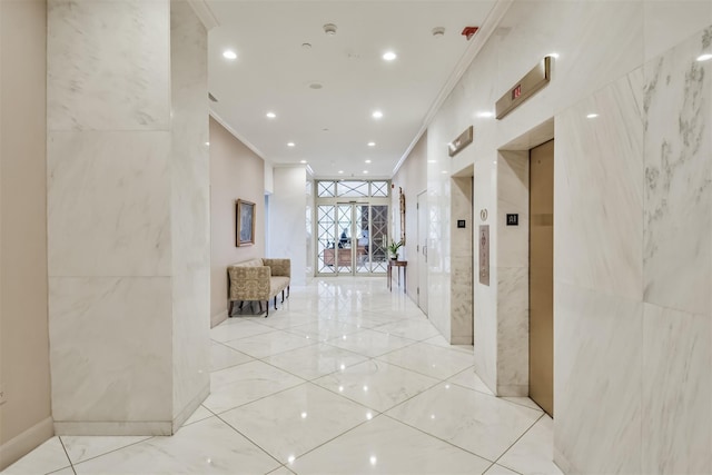 hall featuring tile walls and ornamental molding