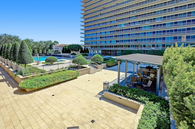 exterior space with a patio area and a pool