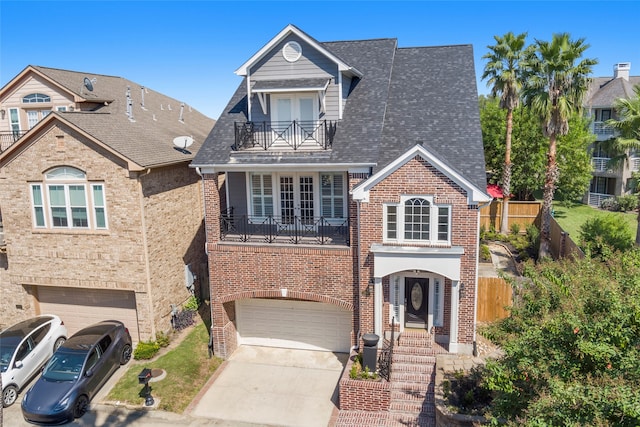 1300 Oceanside Ln, League City, TX 77573 - view of front facade featuring a balcony and a garage