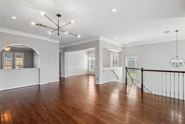 unfurnished room with a healthy amount of sunlight, dark hardwood / wood-style floors, and crown molding