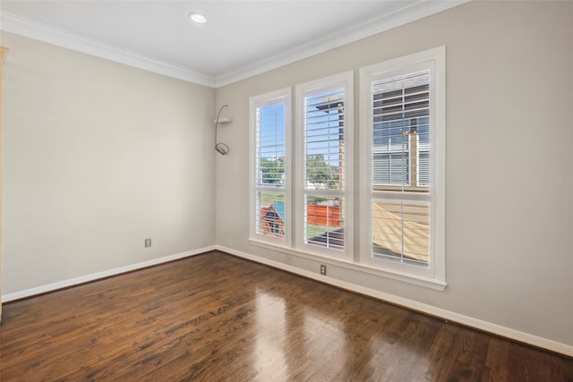 unfurnished room with dark hardwood / wood-style floors and ornamental molding