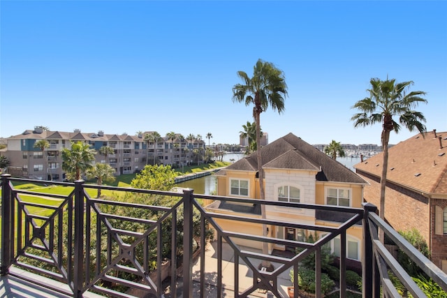 balcony featuring a water view