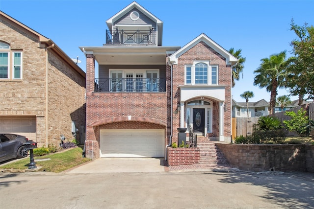 view of front of home with a balcony and a garage