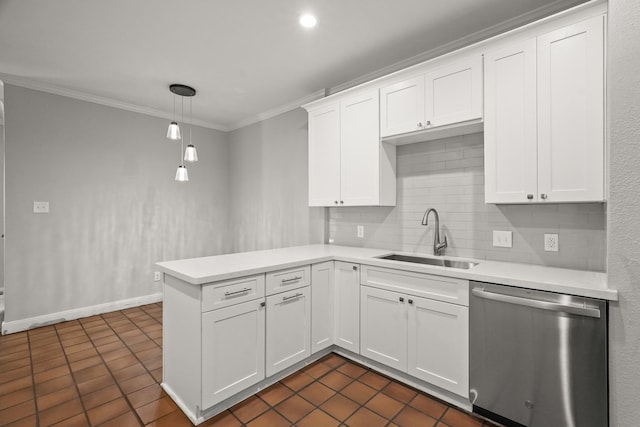 kitchen with light countertops, hanging light fixtures, stainless steel dishwasher, white cabinets, and a sink