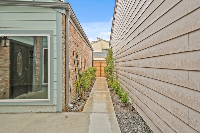 view of home's exterior featuring fence